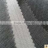 Tricot knitted adhesive interlining fabric