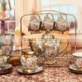 Hot sell electric golden porcelain tea Set teapot sugar bowl creamer cups and saucers Metal holder 15 Pcs 17pcs tea set