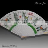 White plastic folding fan