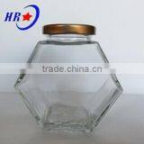 Holding 500g Honey Glass Jar With Golden Lid