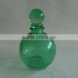 green ball glass perfume bottle