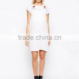 Maternity Embroidered Swing Dress With Dipped Hem China Supplier thumbnail-1
