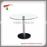 Black base clear glass top dining table