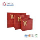 China Seller Customized Paper Gift Packaging Bags with Handmade Accessories