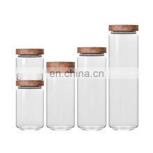 Stocked sealed clear round borosilicate glass packaging containers jar with wood lid