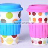 Single wall travel mug with silicone lid and sleeve