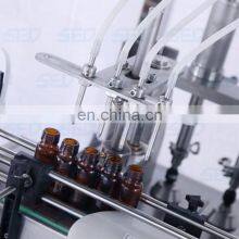 Nice Quality Automatic 4 Heads Glass Bottle Filling and Capping Machine thumbnail-3