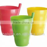 colored plastic drinking cup with straw