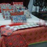 Assortment of decorative home textiles, quilts, throws, cushion covers, ethnic style