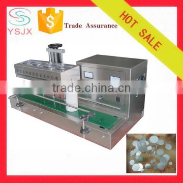 Automatic induction aluminum foil cap sealing machine