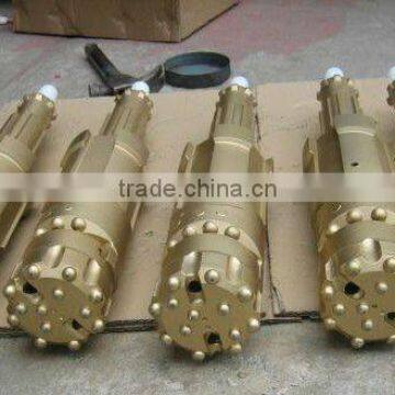 Eccentric overburden casing system with three pieces rock drilling tools