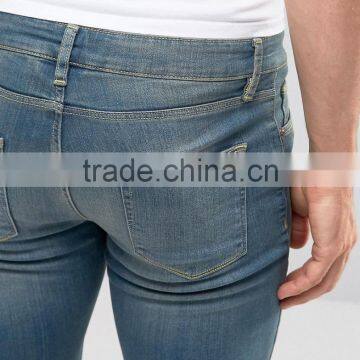 Super Skinny Denim Jeans Distressed Denim Pants With Knee Rips photo-3