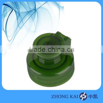 Flip top cap for plastic bottle