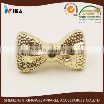 high grade golden bowknot shaped plastic shank button