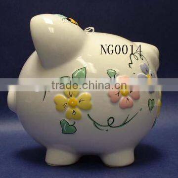 Ceramic piggy bank with embossed design