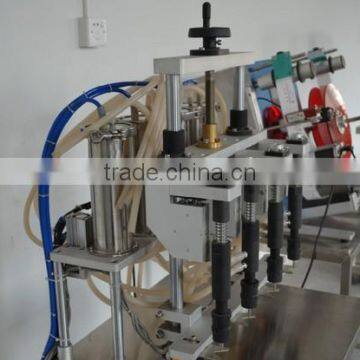 China Guangzhou Factory Small Perfume Bottle Four Head Filling Machine/equipment With Negative Pressure for Sale photo-3