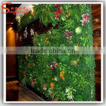 Green artificial garden plant wall