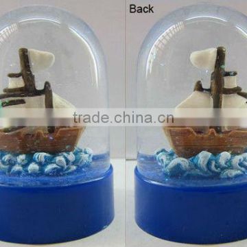 Plastic sea snow globe with boat figurine inner