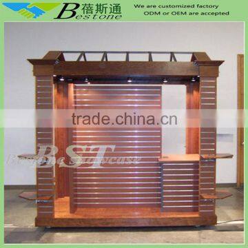 Retail merchandise kiosk at airport, wooden kiosk with slatwall