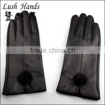 lady's black genuine leather gloves with black rabbit fur ball