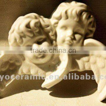 white porcelain angel head with wing ornament