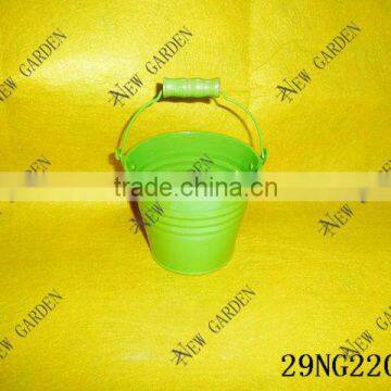 light green metal bucket with wooden handle