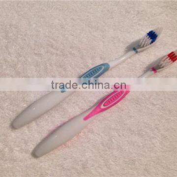 Wholesale adult toothbrush with colored soft rubber handle