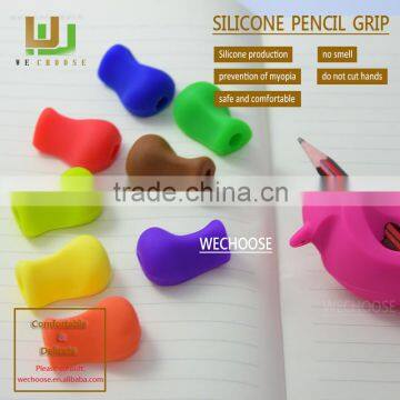 Factory direct sell silicone pencil grip soft and safe pen holder beneficiial for kids handwriting