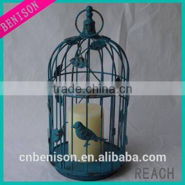 Antique color decorative metal birdcage with glass candleholder