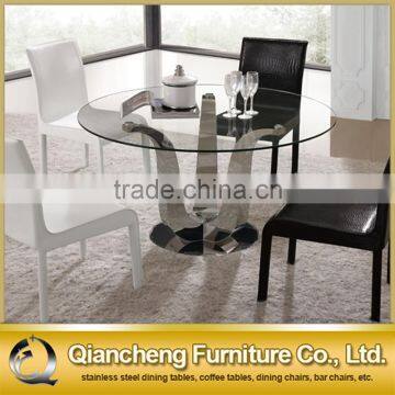 simple design dining table with clear glass top