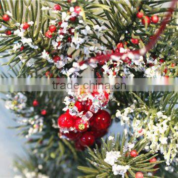 pine tree red fruit branch winter festival decorationwith snowy effect