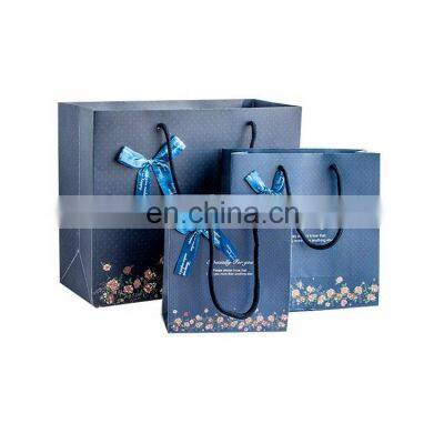 Fancy Printed Graphic Boutique Clothes Packaging Gift Cardboard Bow-tie Decoration Blue Paper Bag with Rope Handle