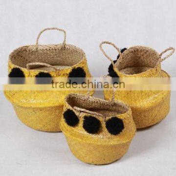 High quality best selling eco-friendly Yellow seagrass baskets with black pompoms from Vietnam