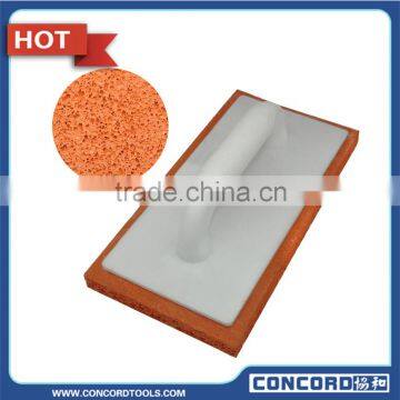 Low density orange masonry float with plastic handle