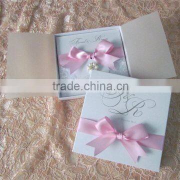 2016 hot sale customized romantic lace wedding invitation cards with bowknot made of pink ribbons and pearl decoration                        
                                                Quality Choice