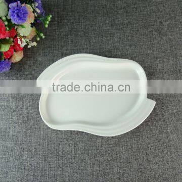 white porcelain unique shaped dessert plates