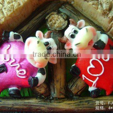 Polyresin cow with heart