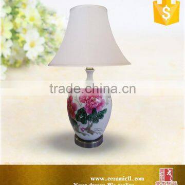 Flower painted white besides table lamps