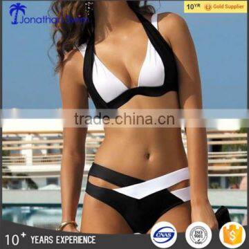 Women's elegant cross black and white nylon spandex bikini.