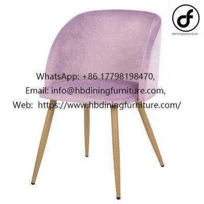 Velvet upholstered curved back dining chair