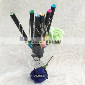 7" black wooden pencil sharpened with crystal gem and plastic accessaries