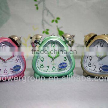 trilateral shape two bells alarm clock in bedroom