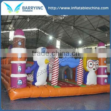 Inflatable penguin playground with lollipop