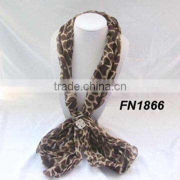 Leopard grain scarf with charm clasp