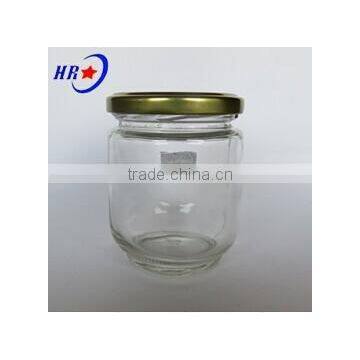 round glass jar with golden lid