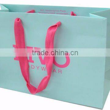 mint paper bag with pink silk handle