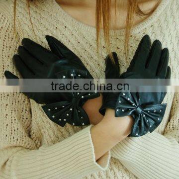 stylish black studded gloves in a big bow