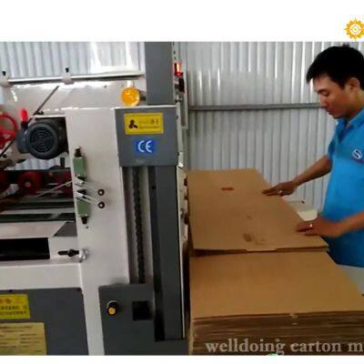 Máquina de plegado y pegado de cajas de cartón corrugado semiautomática