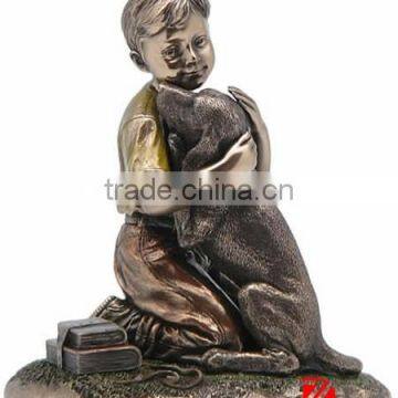 Sitting on floor bronze boy huging a dog statue