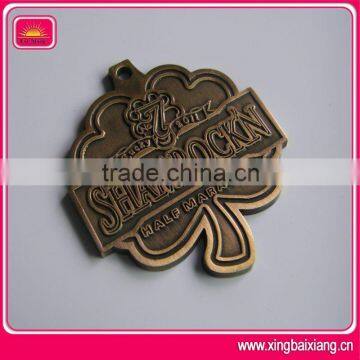 Leaf shape embossed metal medal